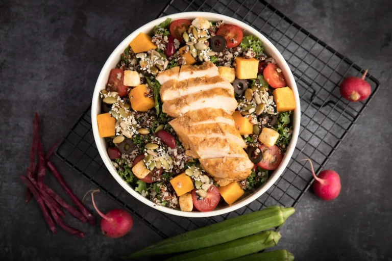 A healthy salad bowl with grilled chicken, showcasing mindful eating.